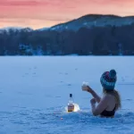 Woman In Black Bikini Top Holding Clear Plastic Bottle On Water