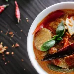 Flat-Lay Photography Of Vegetable Soup On White Ceramic Cup